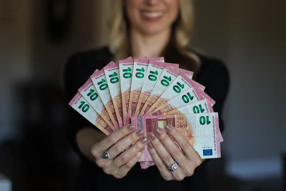 woman holding euros