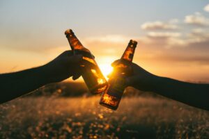beer cheering in sunset